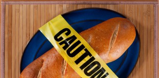 Ein Baguette mit einem "Caution" Klebeband drum herum
